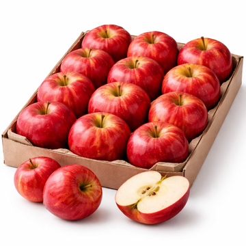Box of red apples with a halved apple on a white background