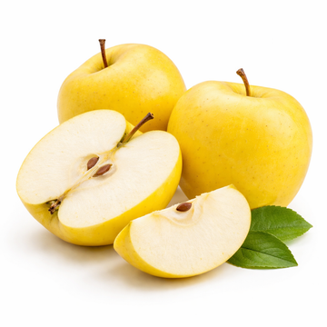 Yellow apples, one sliced open, on a white background